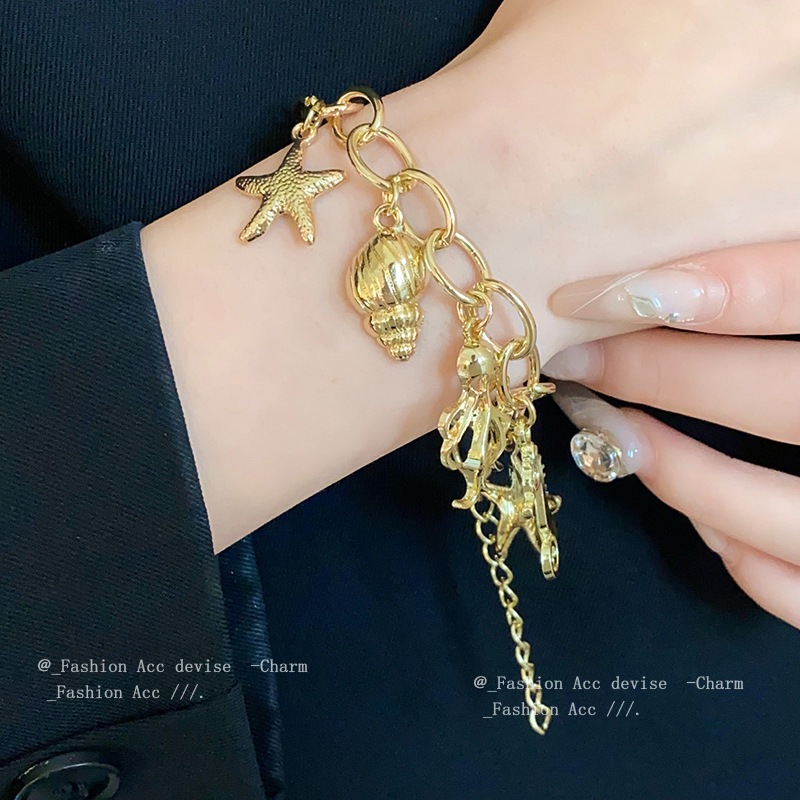 ลมวันหยุดปลาดาวหอยสังข์สร้อยข้อมือโซ่ปลาหมึกยักษ์ยุโรปและสหรัฐอเมริกาความรู้สึกอาวุโสบุคลิกภาพสร้อยข้อมือย้อนยุคโอ้อวดเครื่องประดับมือขายส่ง
