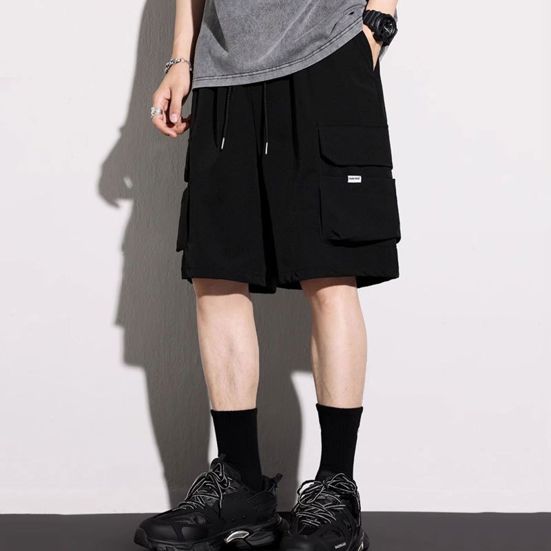 M-5XL กางเกงขาสั้นผู้ชาย แฟชั่นหลวมสบายๆขนาดบวกหลายกระเป๋ากางเกงขาสั้นคาร์โก้สีดํา