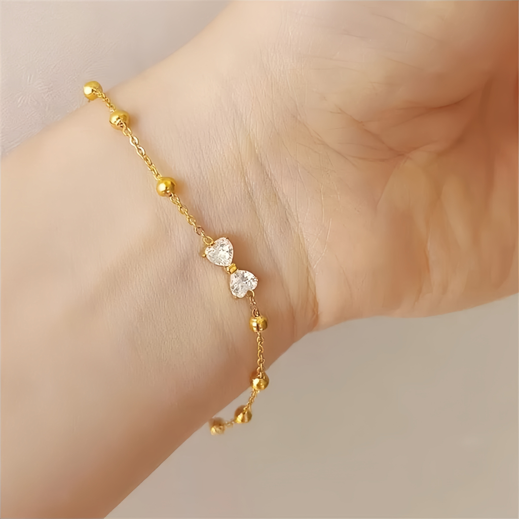ญี่ปุ่นเกาหลีแฟชั่นโบว์เพทายสร้อยข้อมือelectroplating k Gold Non-Fadeใหม่หรูหราไทเทเนียมเหล็ก Classyสร้อยข้อมือ