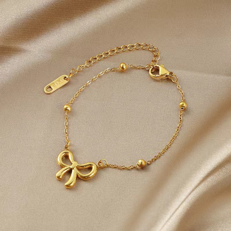 ใหม่ หวาน สร้อยคอ สร้อยข้อมือ ชุดต่างหู ปมผีเสื้อเจ้าหญิง รันอะเวย์ สร้อยข้อมือเหล็กไทเทเนียมลูกปัดกลมสไตล์แฟชั่นผู้หญิงอเนกประสงค์เรียบง่ายไม่ซีดจางเครื่อ - รูปที่ 5