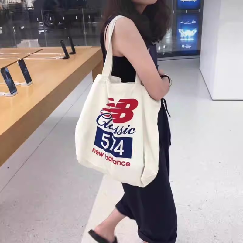 New BALANCE NB Canvas Bag 574 Crossbody Bag ins กระเป๋าเป้ไหล่เดี่ยว