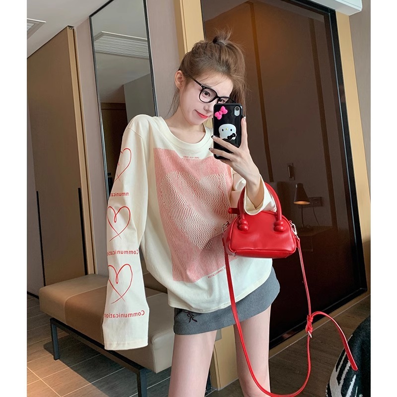 NZN สไตล์เกาหลีย้อนยุคไหล่ด้านบนผ้าฝ้ายหลวมคอลูกเรือแขนยาวเสื้อยืดผู้หญิง
