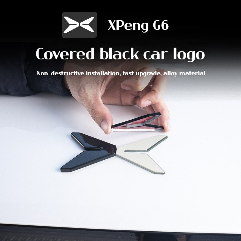 เหมาะสำหรับ Xpeng G6 ทำจากโลหะผสมสังกะสีหุ้มด้วยอุปกรณ์เสริมการปรับเปลี่ยนสไตล์โลโก้รถสีดำสดใส