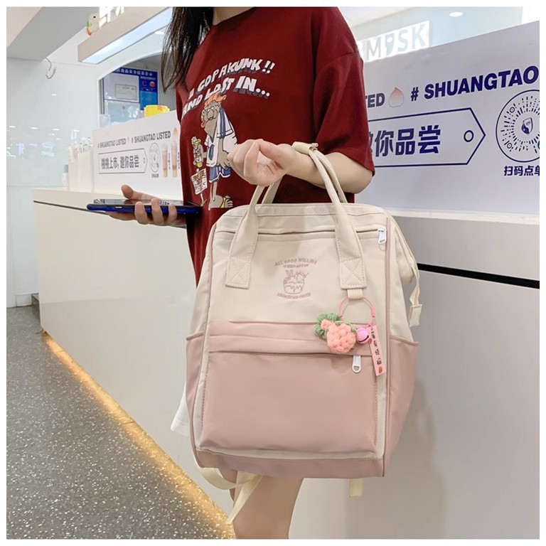 กระเป๋าเป้สะพายหลัง กระเป๋านักเรียน จุของได้เยอะ ลายโดนัท สีมาการอง สไตล์เกาหลี สําหรับผู้หญิง