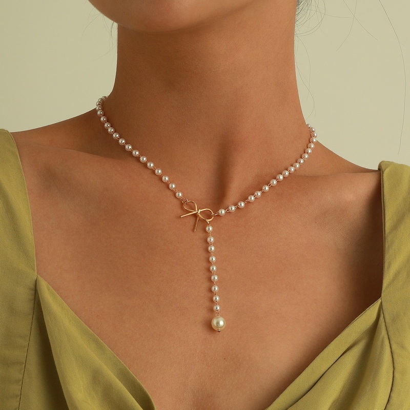 แฟชั่น Retro Bow Pearl พู่สร้อยคอยาวสร้อยคอผู้หญิงของขวัญเครื่องประดับ