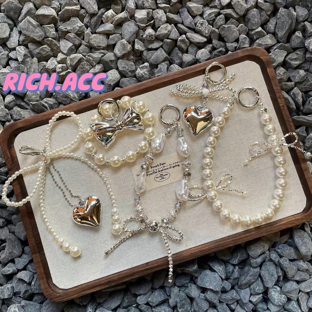 Ins เกาหลีเงิน Bowknot ไข่มุกลูกปัดอินเทรนด์โทรศัพท์จี้น่ารัก Charm สําหรับ iPhone อุปกรณ์เสริม Key Chain กระเป๋ากล้องตกแต่ง