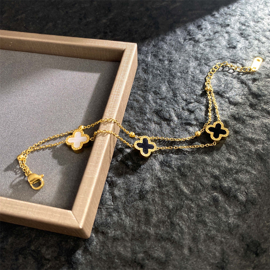 ญี่ปุ่นสไตล์เกาหลีสองชั้นสีดําสีขาวเชลล์สองด้านโคลเวอร์สี่ใบไทเทเนียม - รูปที่ 3