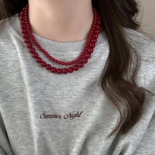 Ancora สร้อยคอจี้ลูกปัดสีแดงผู้หญิงการออกแบบเฉพาะความรู้สึกโซ่เสื้อกันหนาวย้อนยุคความรู้สึกอาวุโสฤดูใบไม้ร่วงและฤดูหนาวอุปกรณ์เสริม