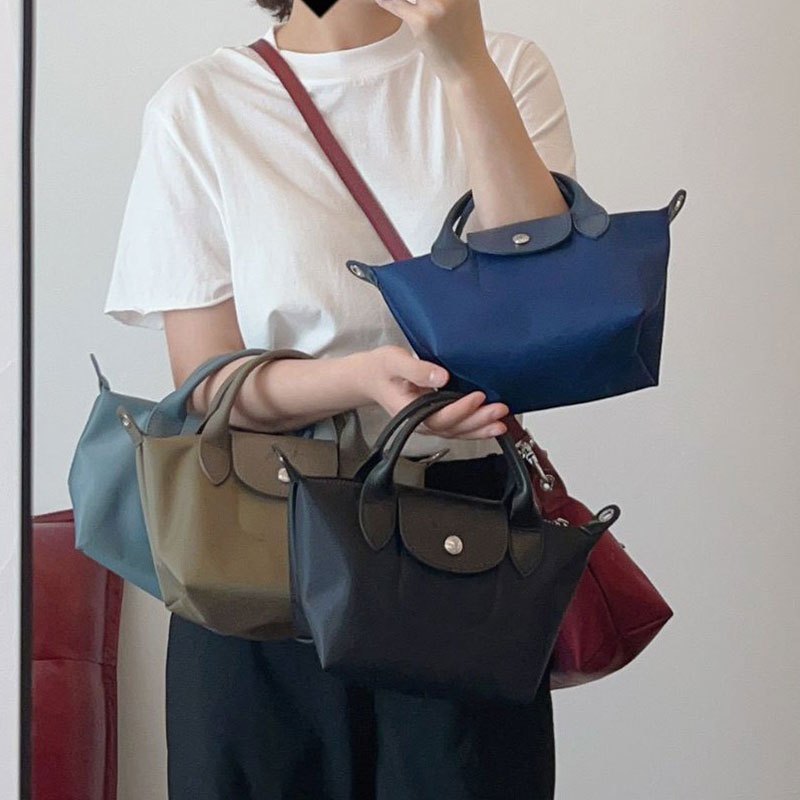 สงคราม ม้า ใหม่ผู้หญิงไหล่ข้างเดียวกระเป๋าเกี๊ยวไนลอน หนังวัว กระเป๋าผู้หญิงที่มีสายสะพายไหล่ปรับได้