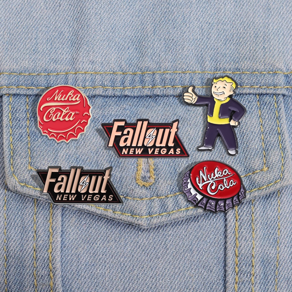 Fallout ใหม่ Vegas เกมโลโก้ Badge Nuka Cola เข็มกลัดโค้กขวดหมวกเคลือบ Pin Gamer ของขวัญอุปกรณ์เสริม