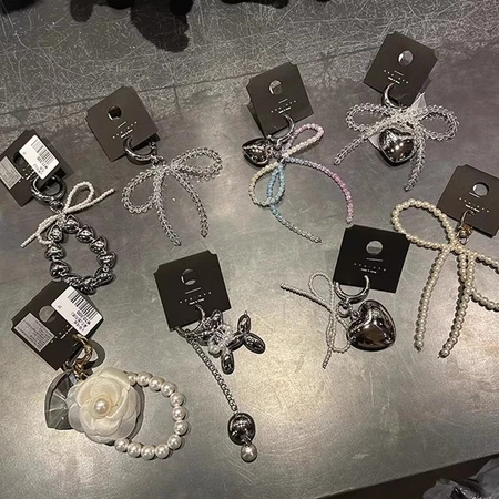 Ins เกาหลี Bowknot ไข่มุกลูกปัดอินเทรนด์โทรศัพท์จี้น่ารัก Charm สําหรับ iPhone Samsung อุปกรณ์เสริม Key Chain กระเป๋ากล้องตกแต่ง