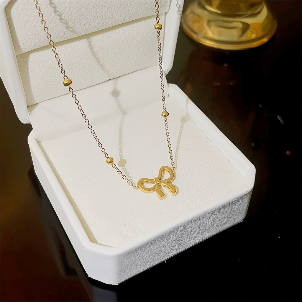 หรูหรา Golden Bow สร้อยคอเหล็กไทเทเนียม Niche Temperament Peas Clavicle Chain ความรู้สึกระดับไฮเอนด์ Simple All-Match