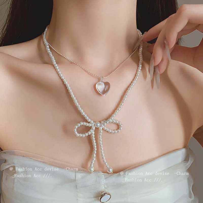 ซูเปอร์แฟรี่โบว์มุกเทียมคริสตัลสร้อยคอฝรั่งเศสความรู้สึกที่เหนือกว่าลูกปัดกระดูกไหปลาร้าโซ่พร็อพปกใหม่สําหรับผู้หญิง
