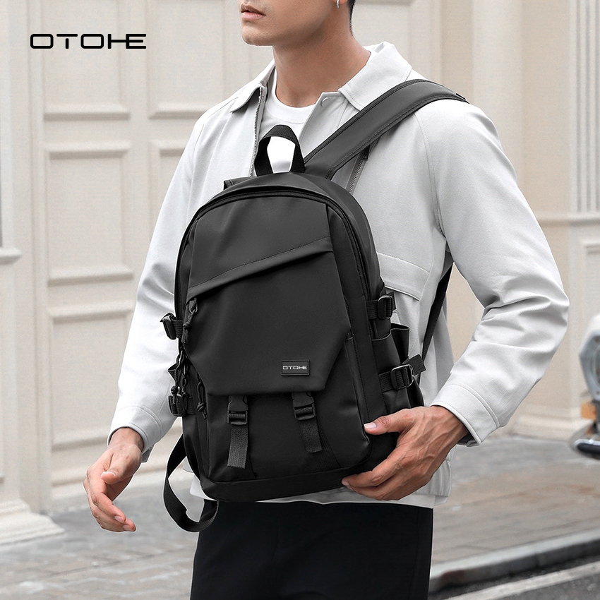 OTOHE ผู้ชายกระเป๋าเป้สะพายหลังสันทนาการแล็ปท็อปกระเป๋าเป้สะพายหลังฟิล์มกันน้ําเดินทางกระเป๋าเป้สะพายหลังธุรกิจกระเป๋าวิทยาลัยกร