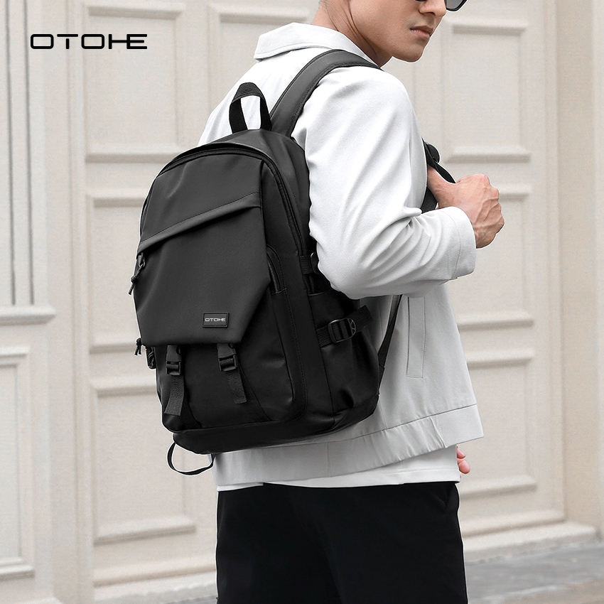 OTOHE ผู้ชายกระเป๋าเป้สะพายหลังสันทนาการแล็ปท็อปกระเป๋าเป้สะพายหลังฟิล์มกันน้ําเดินทางกระเป๋าเป้สะพายหลังธุรกิจกระเป๋าวิทยาลัยกร