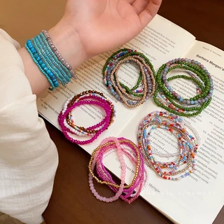 หลากสี หลายสีข้าวลูกปัดซ้อนสวมสร้อยข้อมือแสงหรูหราความรู้สึกระดับสูงของอารมณ์สตริงชนกลุ่มน้อยแฟชั่นลมแห่งชาติเครื่องประดับมือ
