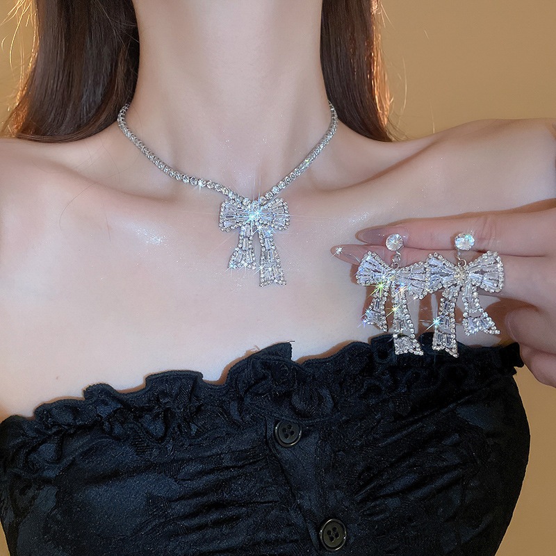 [Jewbeauty]เข็มเงินชุดโบว์เพชรสี่เหลี่ยมคางหมูเพทายสร้อยคอต่างหูชุดแสงหรูหราความรู้สึกสูงแฟชั่นออกแบบเครื่องประดับขายส่ง