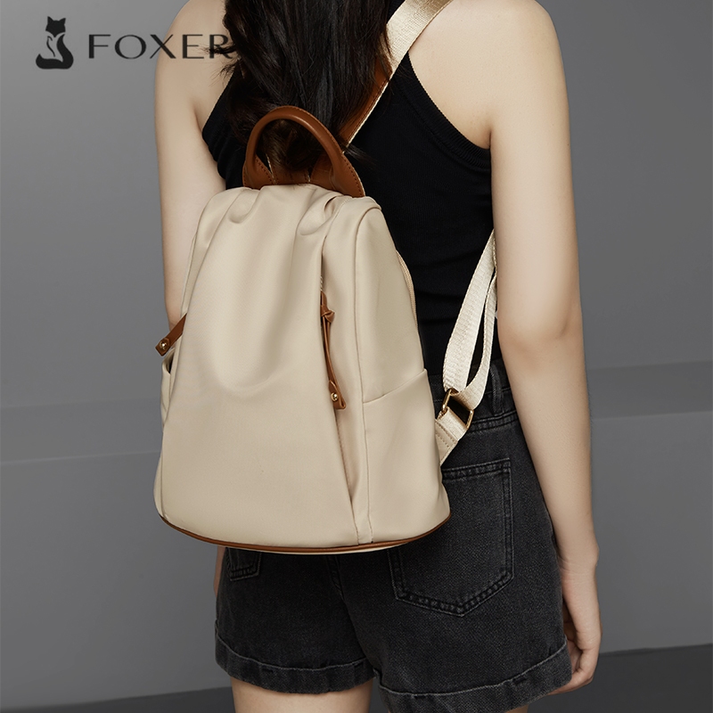 FOXER กระเป๋าเป้สะพายหลังผู้หญิง กระเป๋าเป้สะพายหลังผ้าใบ กระเป๋าแฟชั่นนักเรียน กระเป๋าเดินทาง