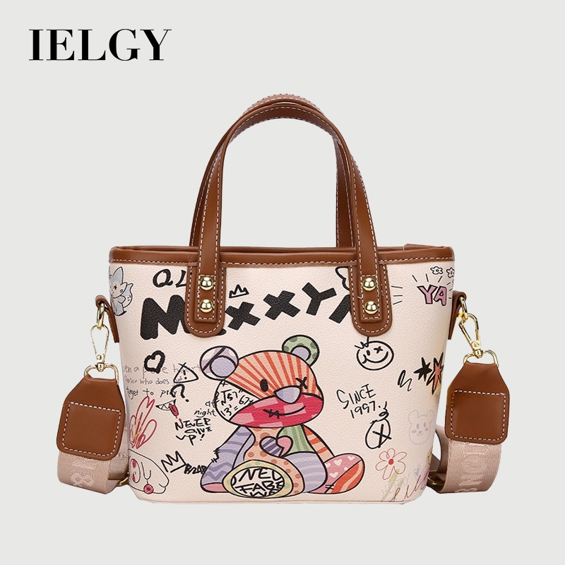 IELGY กระเป๋าถือความจุขนาดใหญ่ผู้หญิงส่วนบุคคลกราฟฟิตีกระเป๋าสะพายแฟชั่นการ์ตูนกระเป๋าถัง