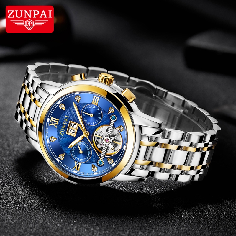 ZUNPAI นาฬิกาข้อมือผู้ชายสายสแตนเลสแบบ Tourbillon อัตโนมัติ พร้อมหน้าต่างกลวง หน้าปัดทรงกลม ทนทานต่อรอยขีดข่วน นาฬิกาแฟชั่นสำหรับธุรกิจ เรียบง่ายและลำลอง กันน้ำ เรืองแสง ปฏิทินถาวร ฟังก์ชันปฏิทินรายสัปดาห์