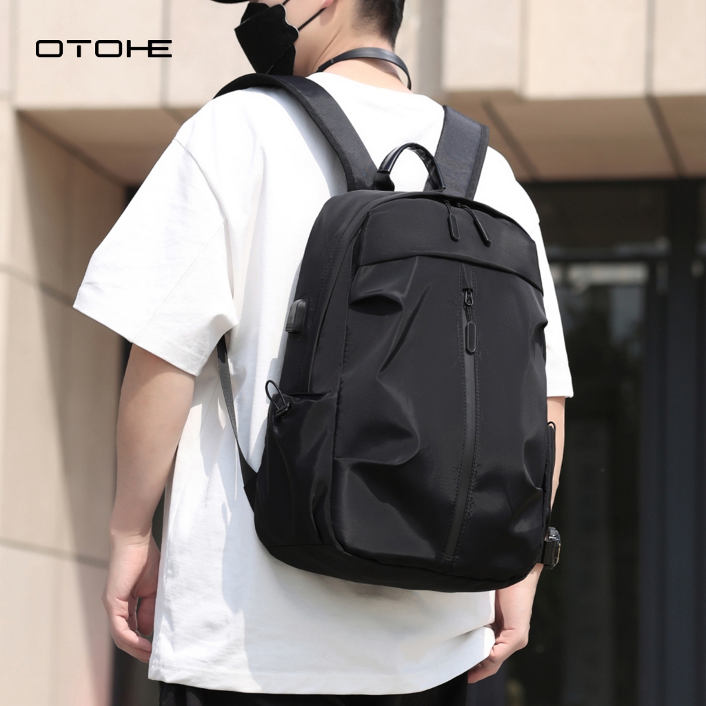 OTOHE กระเป๋าเป้สะพายหลังผู้ชาย USB ชาร์จแล็ปท็อปกระเป๋าเป้สะพายหลัง Casual Travel กระเป๋านักเรียน Dacron กระเป๋าเป้สะพายหลังสีทึบ