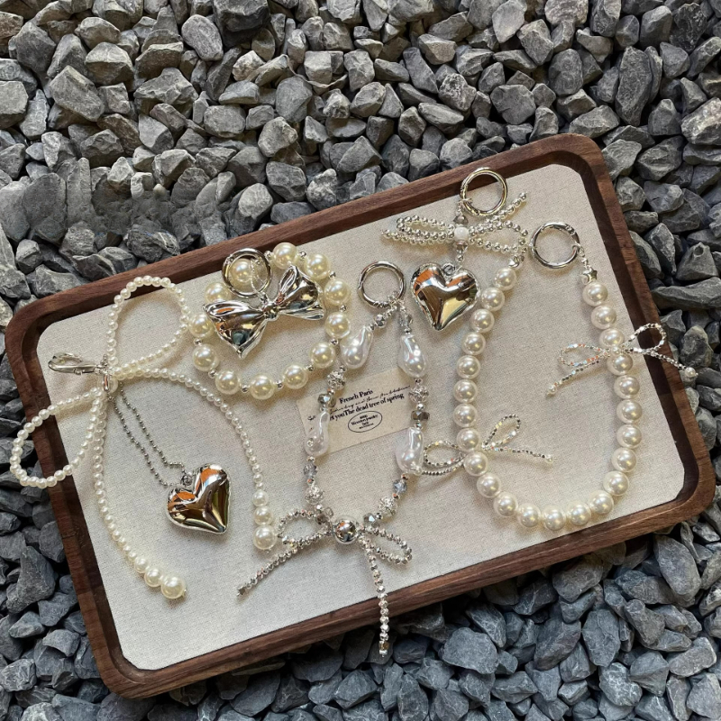 น่ารัก Bowknot Love Heart Pearl โทรศัพท์ Charm สายคล้องจี้สําหรับ iPhone Samsung Accessrioes กระเป๋าพวงกุญแจผู้หญิงเชือกแขวน