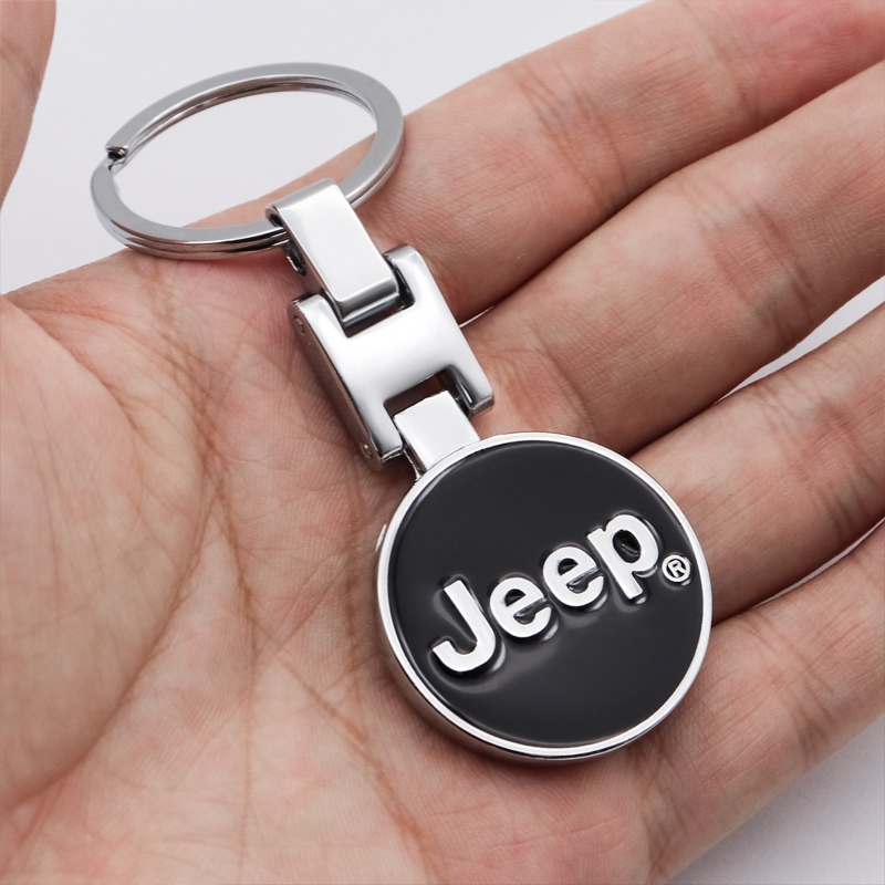 Jeep พวงกุญแจรถโลหะโลโก้แบบพลิกกลับสําหรับ Jeep Wrangler Grand Cherokee เข็มทิศ Renegade Commander Gladiator