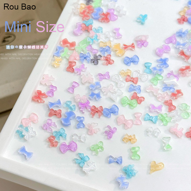 Rou Bao 300 ชิ้น/กล่องเล็บผสมสีสันโบว์สีชมพูสีขาวสีดํา Girly เรซิ่นเล็บ Art DIY Charms ตกแต่ง