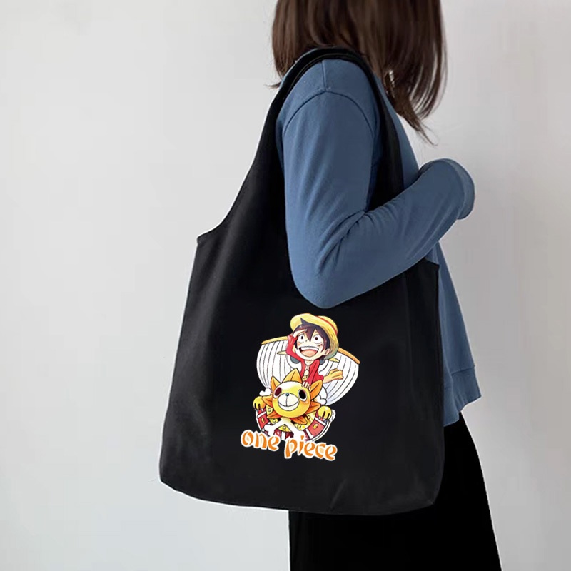 กระเป๋าโท้ต One Piece Luffy Zoro อะนิเมะนักเรียนผ้าใบความจุขนาดใหญ่สาวสไตล์เกาหลีผู้หญิงกระเป๋าสะพายไหล่สุภาพสตรีกระเป๋าถือสลิง