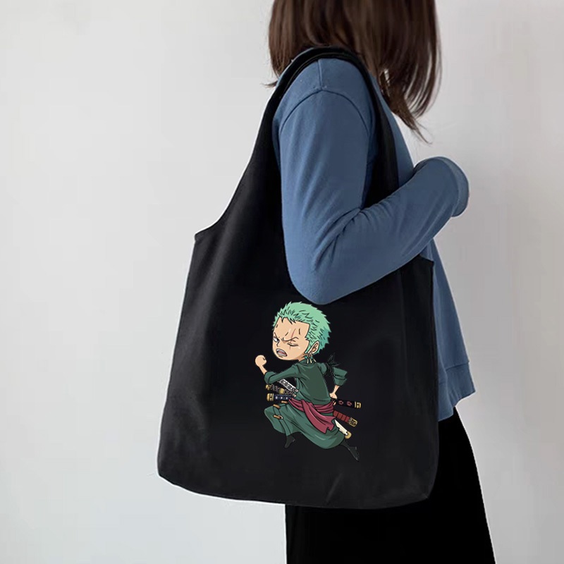 กระเป๋าโท้ต One Piece Luffy Zoro อะนิเมะนักเรียนผ้าใบความจุขนาดใหญ่สาวสไตล์เกาหลีผู้หญิงกระเป๋าสะพายไหล่สุภาพสตรีกระเป๋าถือสลิง