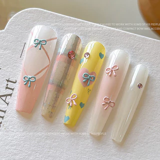 Rou Bao 20 ชิ้นเล็บ Mini Alloy Bow ครีมที่มีสีสัน Hollow Girly เล็บ Art DIY Charms ตกแต่ง