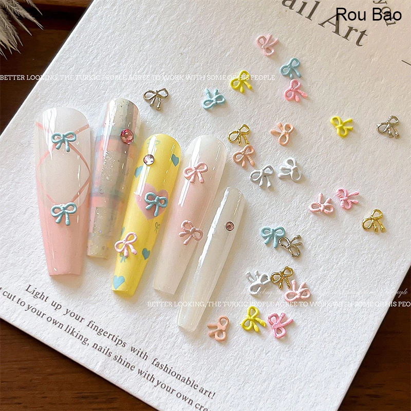 Rou Bao 20 ชิ้นเล็บ Mini Alloy Bow ครีมที่มีสีสัน Hollow Girly เล็บ Art DIY Charms ตกแต่ง