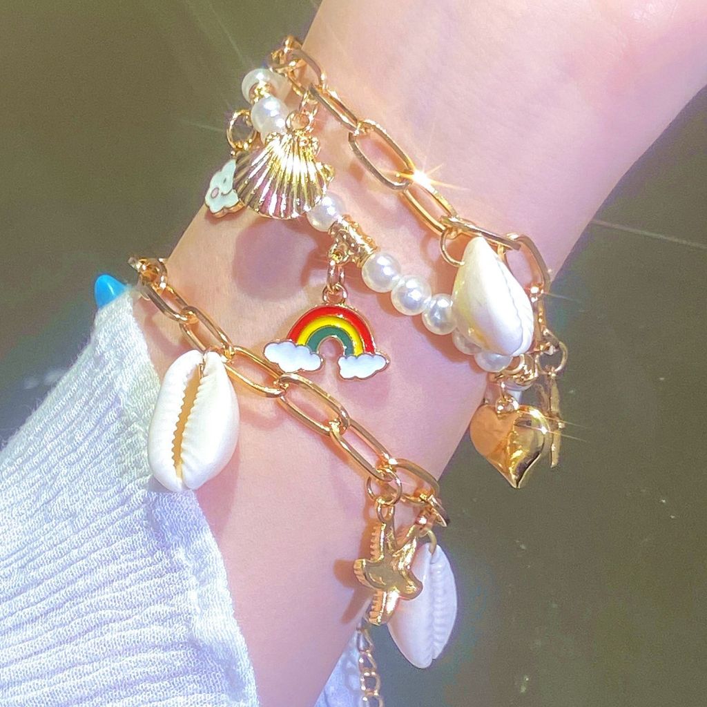 แฟชั่นเกาหลีเปลือกหอยปลาดาวสร้อยข้อมือลูกปัดหญิงสีทอง อิน นักเรียนวันหยุดชายทะเลของขวัญ