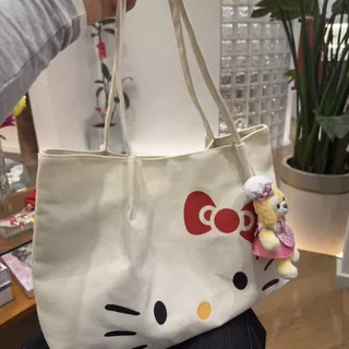 Hello Kitty กระเป๋าผ้าใบความจุขนาดใหญ่กระเป๋าสะพายข้างเดียวที่ทันสมัยและน่ารักสําหรับผู้หญิง