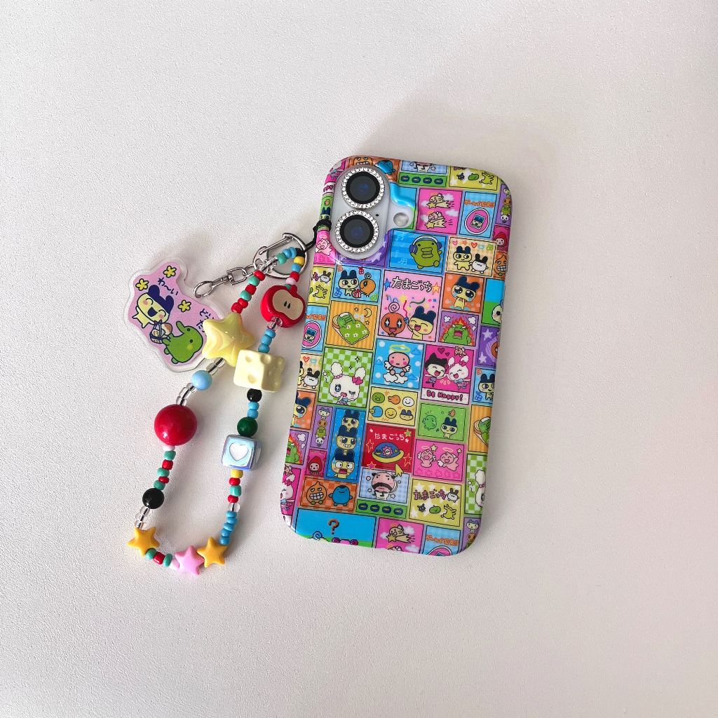 การ์ตูนน่ารักตารางสี Tamagotchi พร้อมสร้อยข้อมือเคสโทรศัพท์สําหรับ iPhone 16, 15, 14, 13 Pro Max ป้องกันกันกระแทกกันชน