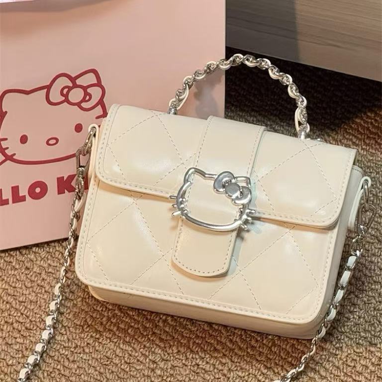 Hello Kitty เวอร์ชั่นเกาหลีกระเป๋าถืออินเทรนด์ผู้หญิงกระเป๋าสะพายเทรนด์นุ่มสไตล์ญี่ปุ่นอเนกประสงค์กระเป๋าสะพายข้างเรียบง่าย