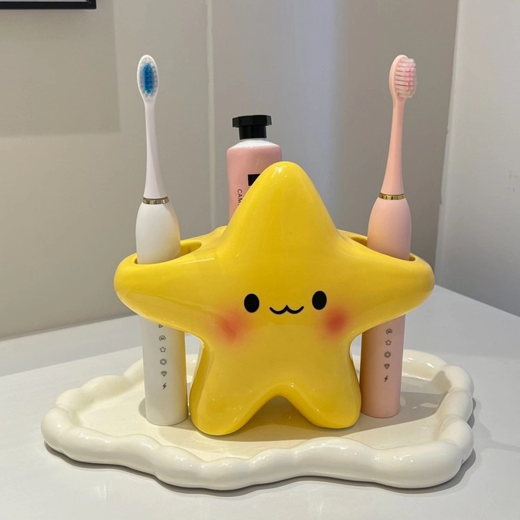 น่ารักรูปดาวแปรงสีฟันชั้นเก็บอัตโนมัติแก้ไขแปรงสีฟันไฟฟ้ากันน้ําพลาสติกห้องน้ํากล่องเก็บของ