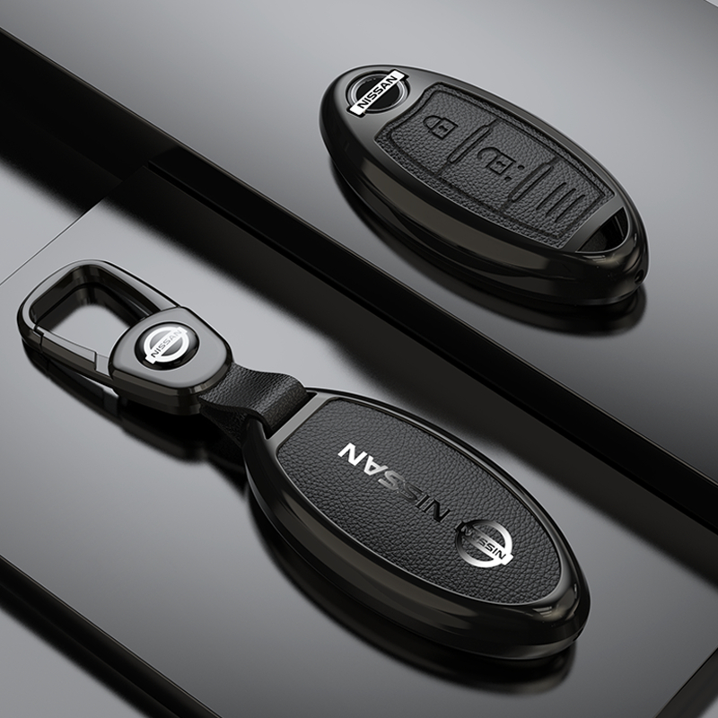 ฝาครอบกุญแจรถโลหะผสมสังกะสีเหมาะสําหรับ Nissan Sylphy Qashqai Nissan Teana Qijun Qida Jinke Bluebird Jin high-end shell buckle กระเป๋าผู้ชายอุปกรณ์เสริมในรถยนต์