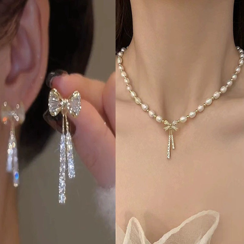 ชุดเครื่องประดับมุกสำหรับผู้หญิง 2 ชิ้น/เซ็ต ประกอบด้วยโบว์จี้ สร้อยคอมุก และต่างหู มุกหรูหราสไตล์แฟชั่น