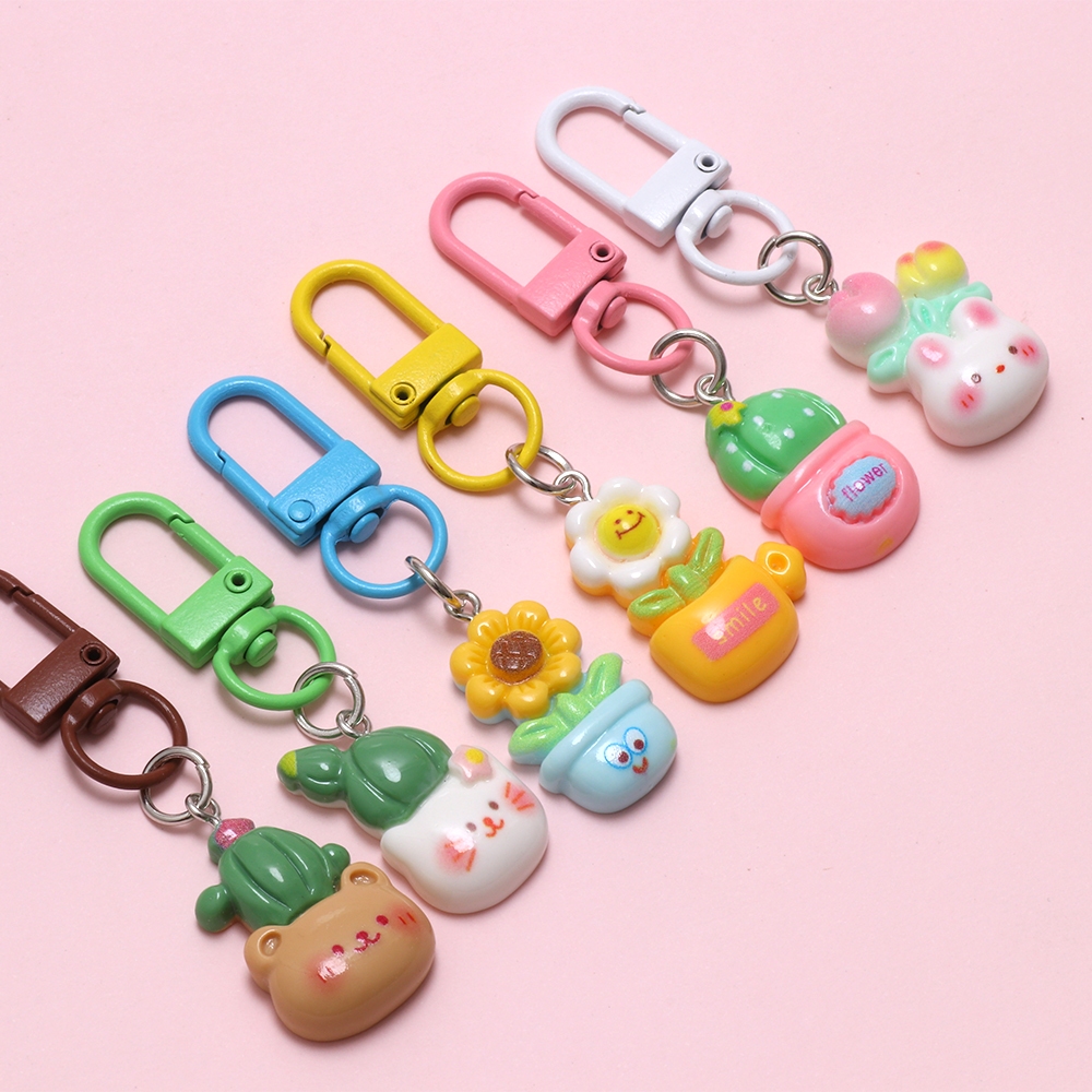 10ชิ้นสุ่มดอกไม้กระถางต้นไม้เรซิ่นพวงกุญแจเครื่องประดับเด็กนักเรียนของขวัญโทรศัพท์จี้เสน่ห์ - รูปที่ 2