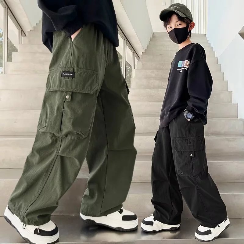 กางเกงเด็กผู้ชาย กางเกงเด็ก Workwear กางเกงสแล็กส์ กระเป๋าหลาย ประเภทรุ่นหลวม แฟชั่น เทรนด์ หล่อ สีเขียวทหาร สีดำ 6-14 ปี 【จัดส่งจากประเทศไทย】 สินค้าพร้อมส่ง