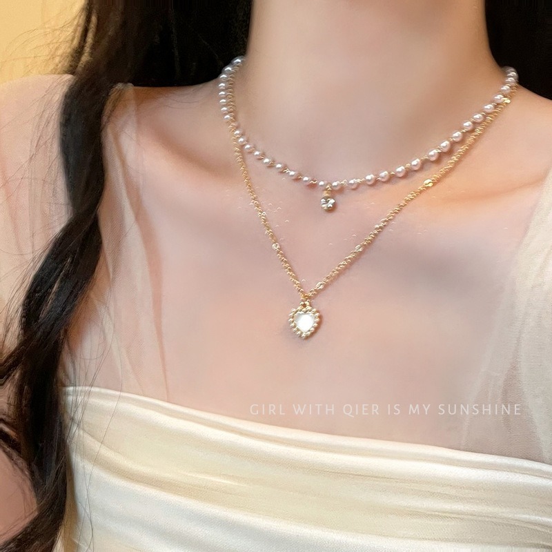สร้อยคอนามธรรมแบบหัวใจ มุกสองชั้นสำหรับผู้หญิง ออกแบบทันสมัยด้วยโซ่ลายเหมือนกระดูกไหปลาร้า