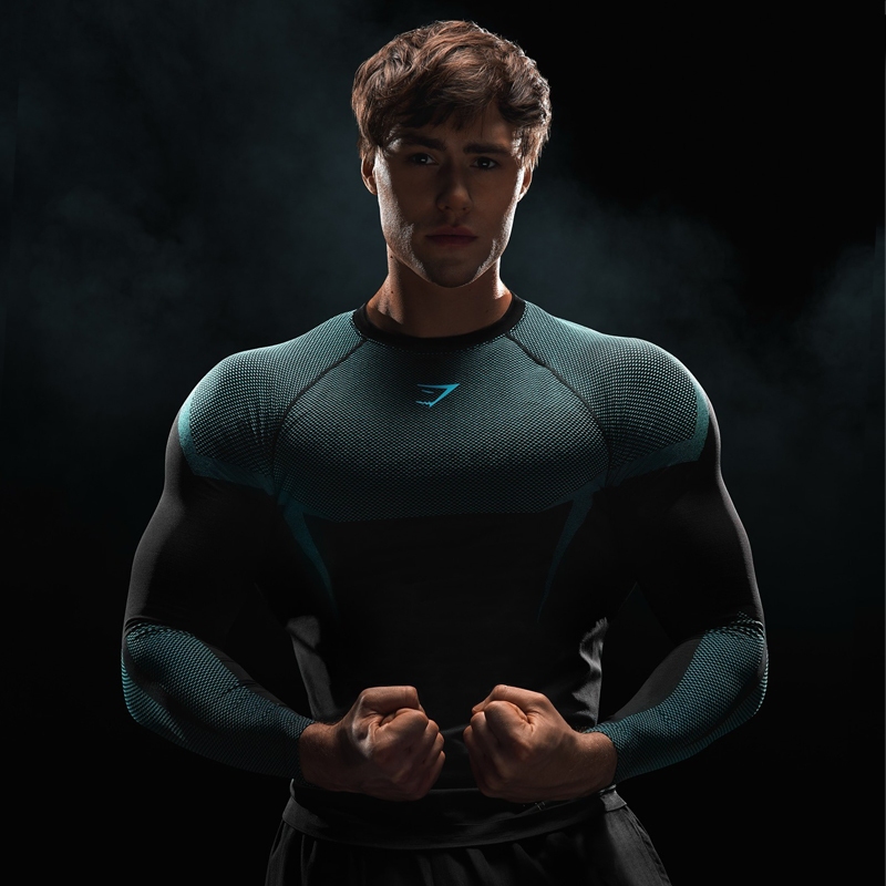GYM ผู้ชายกล้ามเนื้อฟิตเนสเสื้อแขนยาวยืดหยุ่น Slim Fit Top สําหรับกีฬากลางแจ้งการฝึกอบรม GYM