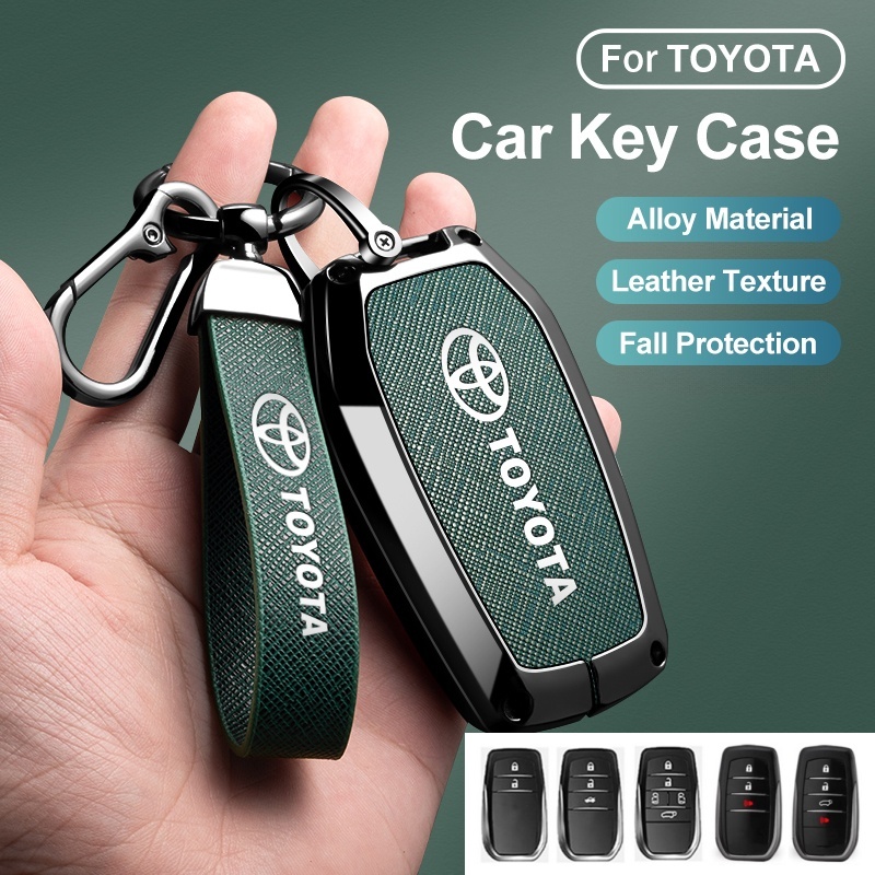 [สต๊อกพร้อม]ฝาครอบกุญแจรถหนังโลหะผสมสําหรับ Toyota Fortuner Hilux Revo Innova Harrier Prado 2/3/4/5 ปุ่มการป้องกันคุณภาพสูงสีเขียว/สีดําอุปกรณ์ตกแต่งภายในรถยนต์