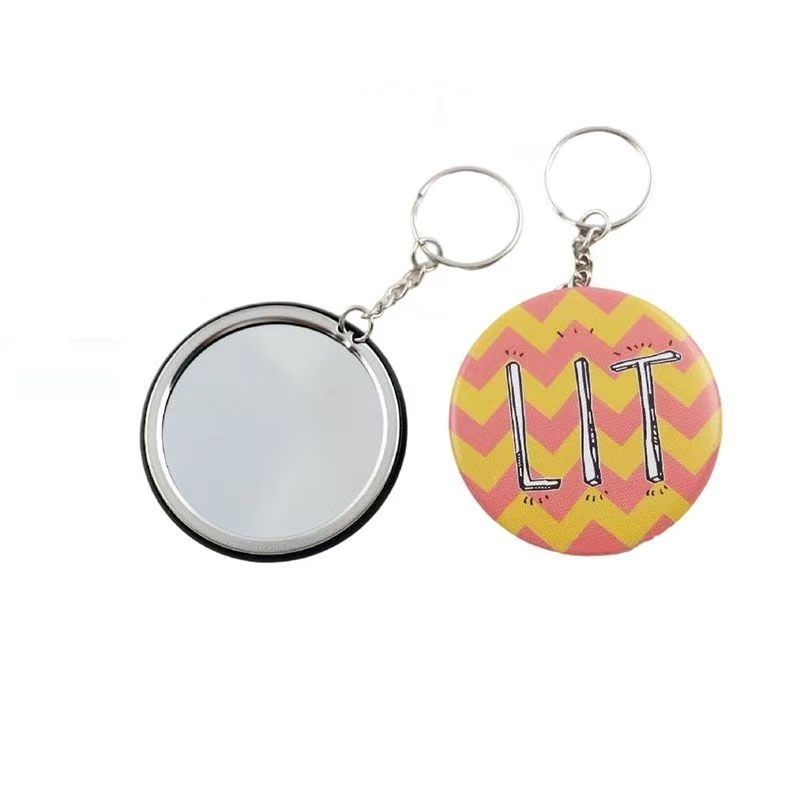 ชิ้นส่วนพวงกุญแจ แหวนโลหะ และปุ่มป้ายวัสดุเปล่า พร้อมกระจกสำหรับตกแต่ง