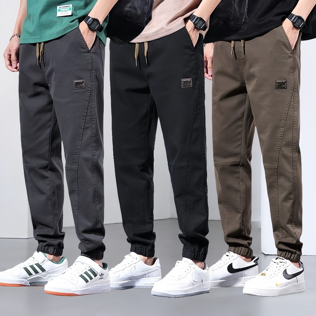กางเกงคาร์โก้ผู้ชาย ผ้ายืดหยุ่นทรงหลวม สไตล์เสื้อกันฝนสำหรับสวมใส่ง่ายทุกวัน