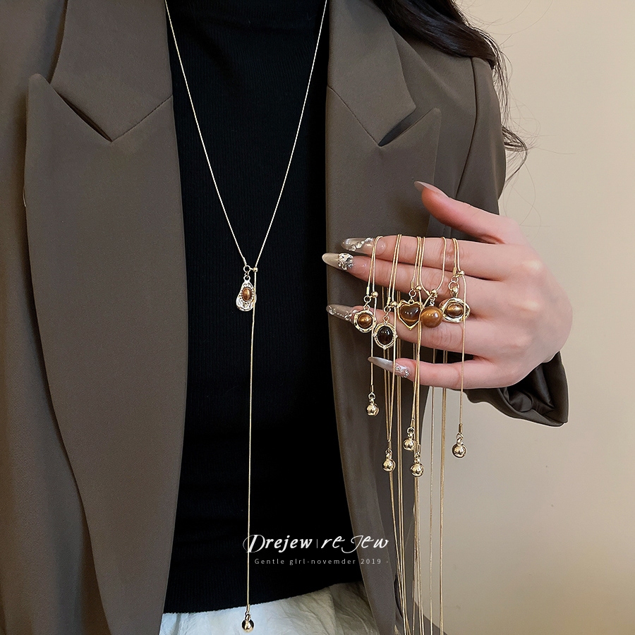 สร้อยคอทองเหลืองลายเสือดาวแบบ Lariat สำหรับผู้หญิง ออกแบบมาในสไตล์ทันสมัย และสามารถปรับขนาดได้ เป็นเครื่องประดับแฟชั่นที่เหมาะสำหรับเป็นของขวัญหรือนำมาสวมใส่เอง