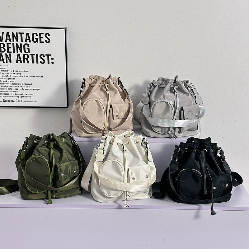 พร้อมสต็อกเกาหลี ins Influencer Drawstring Bucket Bag Female Nylon Canvas Retro Classy Bag One-Shoul