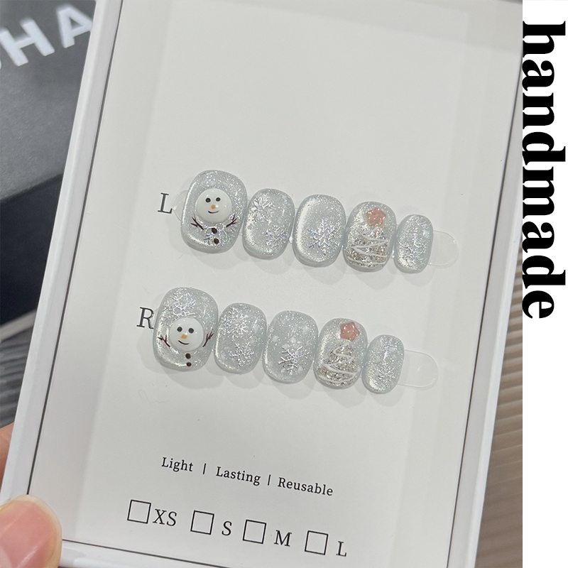 กดบนเล็บ ทําด้วยมือ รูปแบบใหม่เดิมกระพริบแมวตาแต่งเล็บบรรยากาศส่องแสงคริสต์มาสมนุษย์หิมะที่ทําด้วยมือสวมใส่เล็บคริสต์มาสน้ําแข็งหิมะปลอมเ