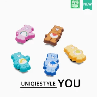 2026 รองเท้ารูจระเข้สไตล์ใหม่ Huazhibixing อุปกรณ์เสริมน่ารักการ์ตูน Care Bear ชุดห้าชิ้นสไตล์ใหม่ Care Bear ร่ม